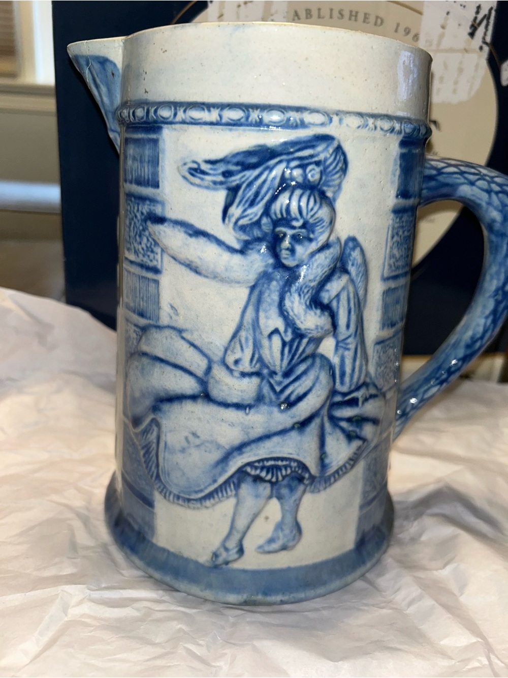 Vintage Embossed blue and white stoneware pitcher by Robinson Pottery Company.